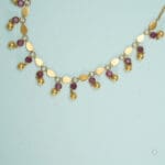 22Kt Gold Charm Necklace with Pink Stones and Matching Earrings ST22/1223 22Kt Gold Charm Necklace with Pink Stones and Matching Earrings ST22/1223