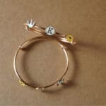 18KT Gold Adjustable Kada for Kids with Elephant, Crown & K Letter Charms KR18/89