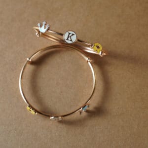 18KT Gold Adjustable Kada for Kids with Elephant, Crown & K Letter Charms KR18/89