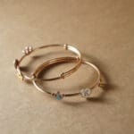 18KT Gold Adjustable Kada for Kids with Elephant, Crown & K Letter Charms KR18/89