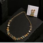 22Kt Gold Charm Necklace with Pink Stones and Matching Earrings ST22/1223